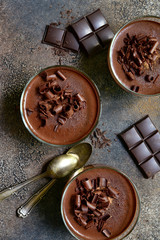 Delicious chocolate mousse in a glasses. Top view with copy space.