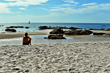 Summer beach vacation concept,  man relaxing on beach, ocean sunny view