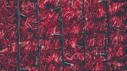 Beautiful Christmas red garland decorations at New Year fair in winter. Background with copy space