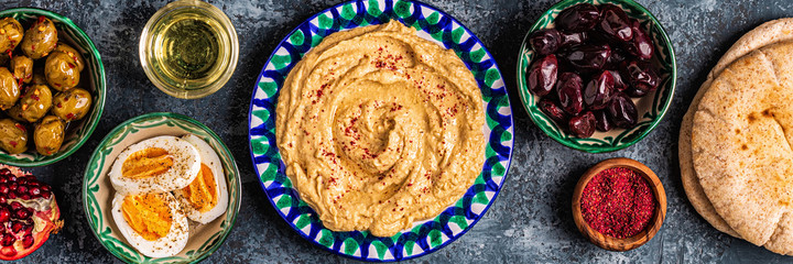 Hummus - traditional dish of Israeli and Middle Eastern cuisine. - obrazy, fototapety, plakaty