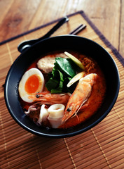 Tom yum kung (Thai cuisine),Tom Yum Kung seafood soup with noodles. Tom yam is a spicy clear soup typical in Thailand