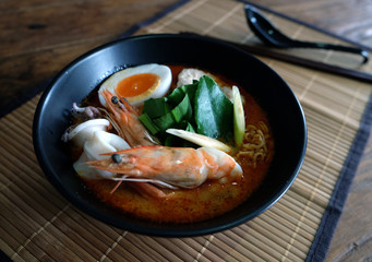 Tom yum kung (Thai cuisine),Tom Yum Kung seafood soup with noodles. Tom yam is a spicy clear soup typical in Thailand