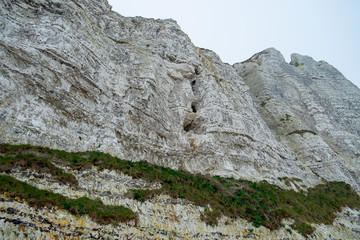 Detail of large chalk cliff face of the rocks on the Normandy coast of France. High quality photo 
