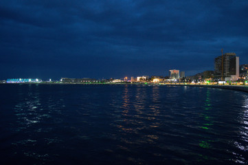 Illuminated Chrystal Hall, Promenade and Caspian Sea in Baku, Azerbaijan