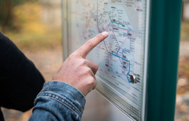 Man hand point on map for traveling destination