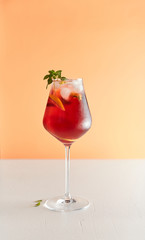 iced tea with herbs and ice in a glass