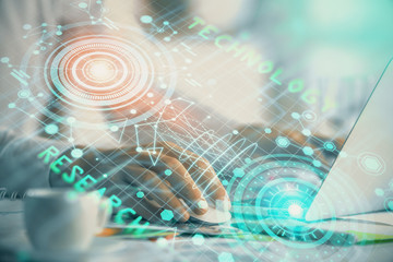 Businessman with computer background with technology theme hologram. Concept of hightech. Multi exposure.