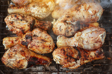 Pork steak grilling on a summer barbecue. BBQ background.