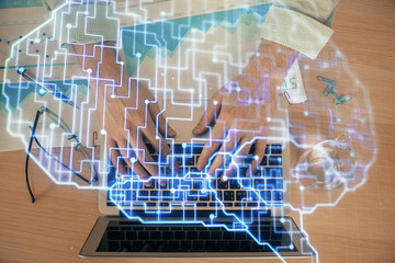 Man typing on keyboard background with brain hologram. Concept of big Data.