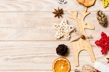 Top view of Christmas decorations and toys on wooden background. Copy space. Empty place for your design. New Year concept