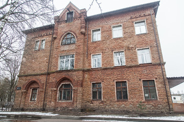 Facade of an old brick city building in winter
