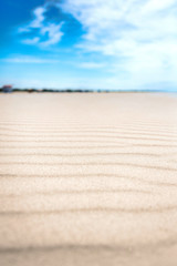 Fototapeta na wymiar Calm day on abandoned white sand beach.