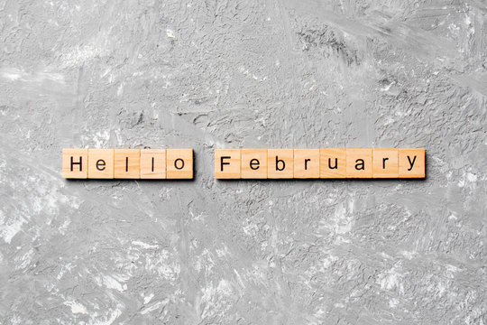 hello February word written on wood block. hello February text on table, concept