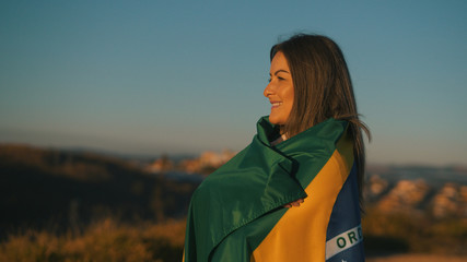 September 7th, Brazil Independence Day, beautiful girl with Brazilian flag - obrazy, fototapety, plakaty