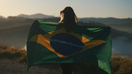 Proud girl of her country with flag of Brazil