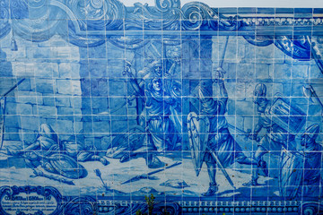Fototapeta na wymiar Example of historical azulejo, ceramic tiles on cathedrals and old city buildings