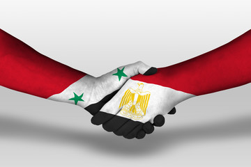 Handshake between egypt and syria flags painted on hands, illustration with clipping path.