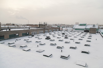 Rooftop of industrial building covered with snow in Saint Petersburg