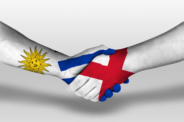 Handshake between england and uruguay flags painted on hands, illustration with clipping path.