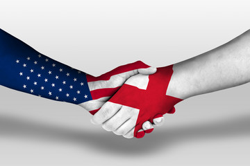 Handshake between england and united states of america flags painted on hands, illustration with...