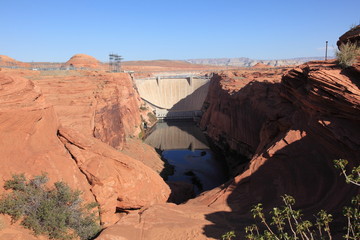 View of Glen Canyon Dam and bridge with Colorado River near the town of Page in Arizona USA