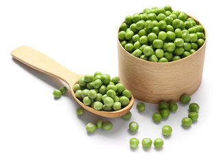 Box and spoon with tasty fresh peas on white background