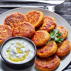 Paleo diet pumpkin cakes with tzatziki sauce