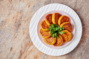 Healthy diet pumpkin cakes on a plate, copy space