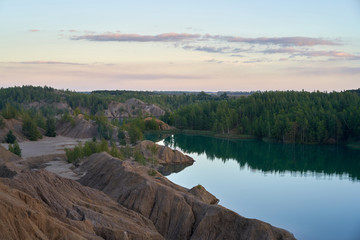 Landscape with Romantsevskiye mountains and lake at sunset near to the Konduki village in Tula Region in Russia.