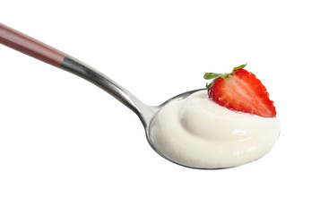 Spoon with strawberry yogurt on white background