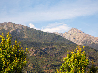Landscape of mountains under a blue cloudy sky