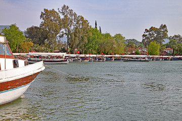 Vessels from the Dalyan Boat Cooperative moored by the side of the Dalyan River