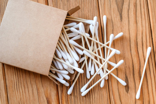 Wooden cotton buds. View from above. Wood background