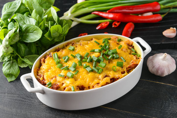 Baking dish with tasty beef casserole on table