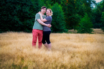 Guy with a girl hugging in nature. Portrait of a young couple.