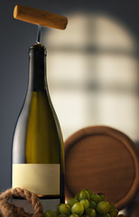 Obraz premium Wine bottle with a corkscrew in the cellar