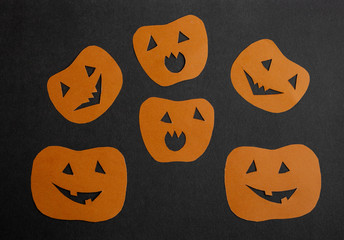 Orange funny pumpkins on a black background.The Concept Of Halloween