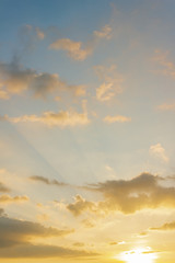 Sunset sky orange clouds in the evening with colorful sunlight vertical 