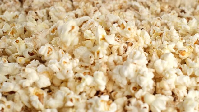 popcorn falling dow and rotating. pour popcorn close up