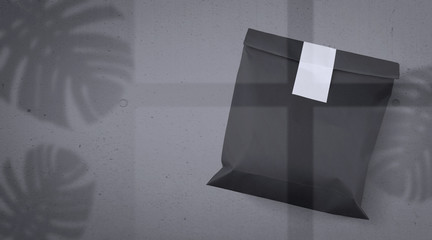 Black Paper Bag with White Sticker Mockup – Window and Exotic Leaves Background
