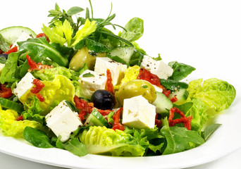 Mixed Salad with Feta Cheese, Olives and dried Tomatoes - Isolated on white Background