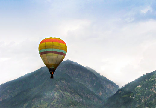Isolated image of hot air balloon high in the air at Manali, India.