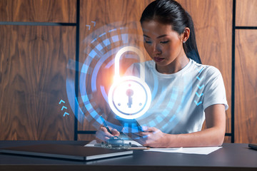Woman takes notes with phone. Security and data protection concept hologram. Multiexposure.
