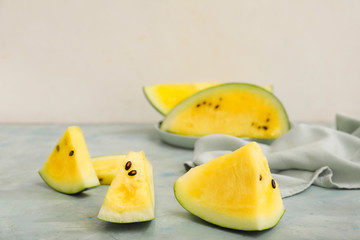 Cut yellow watermelon on table