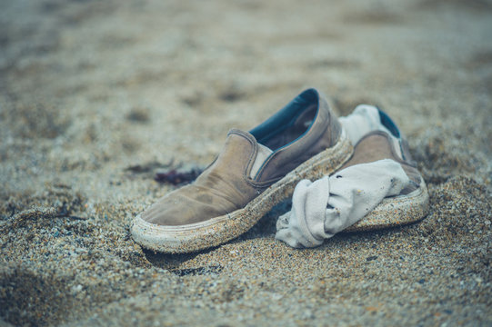 Pair of shoes on the beach in summer