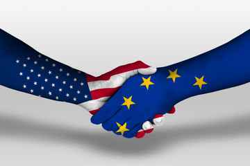 Handshake between european union and united states of america flags painted on hands, illustration with clipping path.