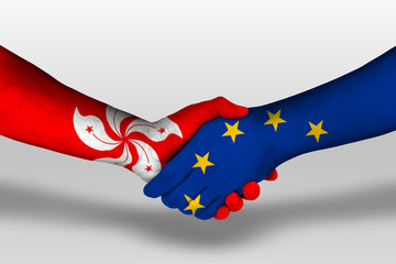 Handshake between european union and hong kong flags painted on hands, illustration with clipping...