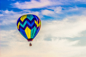 Hot Air Balloon In Early Morning With Blue Sky & Clouds