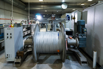 A coil of power electric cable in insulation on a metal coil