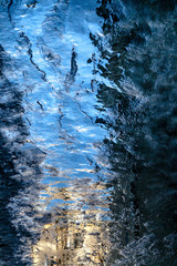 Frozen puddle with oil stain